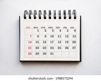 Blank notepad sheet and calendar for your congratulatory message. Closeup, top view. No people. Concept of preparation for a holiday. Congratulations for relatives, friends and colleagues - Shutterstock ID 1988573294