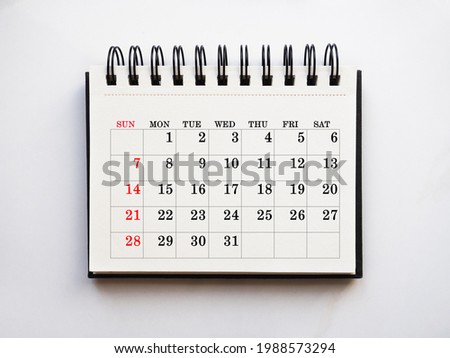 Blank notepad sheet and calendar for your congratulatory message. Closeup, top view. No people. Concept of preparation for a holiday. Congratulations for relatives, friends and colleagues