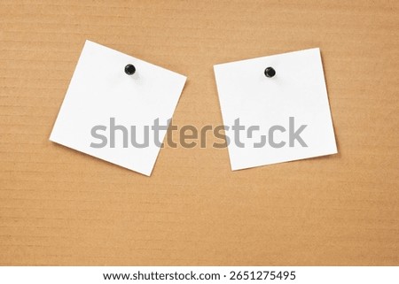 Blank notepaper and space for text with push pins on cardboard background. note blank paper cards. noticeboard on catron board. sticker. blanks for designers
