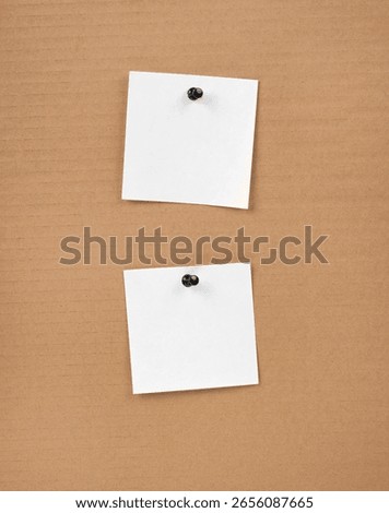 Blank notepaper and space for text with push pins on cardboard background. note blank paper cards. noticeboard on catron board. sticker. blanks for designers
