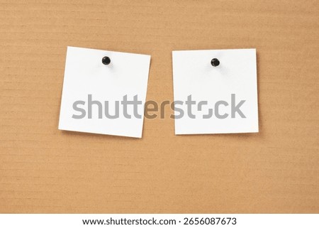 Blank notepaper and space for text with push pins on cardboard background. note blank paper cards. noticeboard on catron board. sticker. blanks for designers