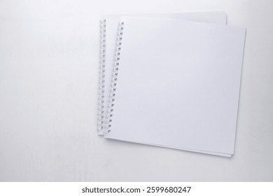 blank open notebook or ring binder isolated on transparent background, business stationery, school, art or craft supplies, top view, flat layout for your scene, copy space
