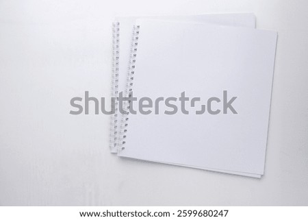 blank open notebook or ring binder isolated on transparent background, business stationery, school, art or craft supplies, top view, flat layout for your scene, copy space