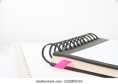 Blank Opened Spiral Notebook Placed On A Table. Empty Open Notepad On Top Of A Desk