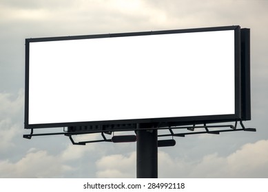 Blank Outdoor Advertising Billboard Hoarding Against Cloudy Sky, White Copy Space for Mock Up Design or Marketing Message