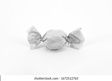 Blank Packaging Candy Plastic Sachet Isolated On White Background. Candy Wrapper Mock-up, Solid White And Transparent. Сan Be Used For Design And Branding.