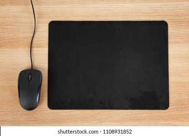 Blank Pad And Computer Mouse On Wooden Background, Top View