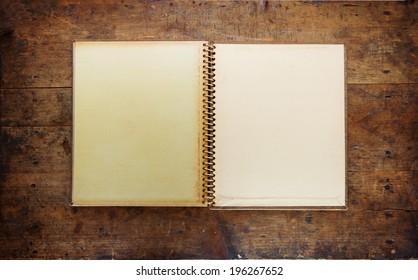 Blank Page Of An 1960s Photo Album, On A Old Wooden Table.  