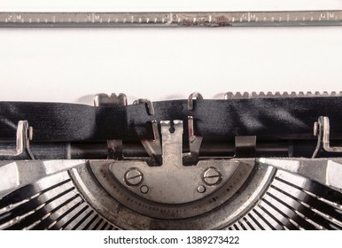 A blank page inserted into a old vintage typewriter. Plenty of copyspace for the insertion of your own text. Macro detail shot.
