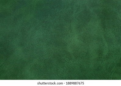 blank page of leather texture background with rough and grunge skin, full frame. Close up detail of textured sheet of green color organic art background. background of rough fabric emerald color.