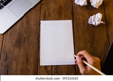 Blank Page Of Paper On Brown Table