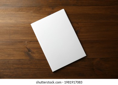 Blank Paper Brochure On Wooden Table, Top View. Mockup For Design