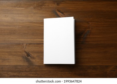 Blank Paper Brochure On Wooden Table, Top View. Mockup For Design