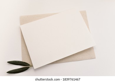 Blank paper card with olive leaves . Copy space for your text, flat lay, top view - Shutterstock ID 1839761467