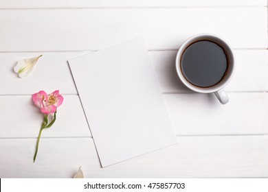 Blank Paper, Coffee And Flower On White Table, Top View