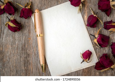 Blank Paper With Dry Roses On Wooden Background. Love Letter. Copy Space.