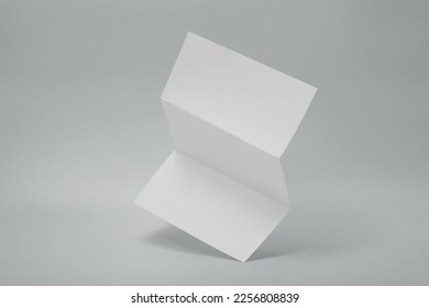 Blank paper folded on gray background - Shutterstock ID 2256808839