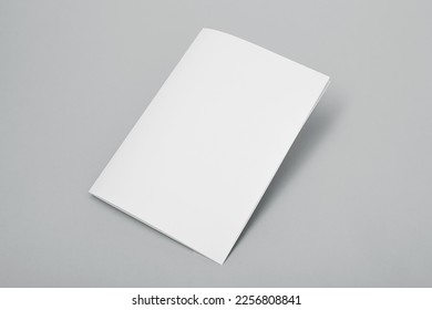 Blank paper folded on gray background - Shutterstock ID 2256808841