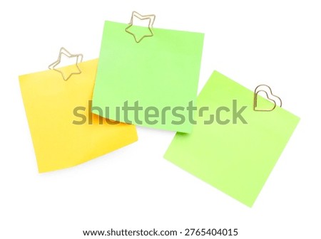 Blank paper notes with clips isolated on white, top view