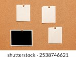 Blank paper notes and an empty photo are pinned to a cork board. The concept of detective investigation.