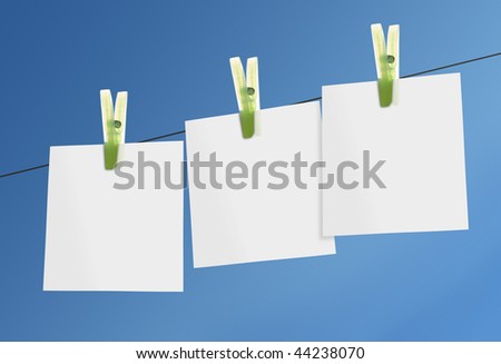 blank paper notes on line against blue sky
