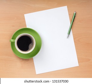 Blank Paper With Pen And Coffee Cup On Wood Table