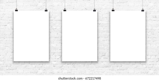 Blank Paper Poster Mockup On A White Brick Wall. 