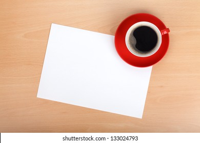 Blank Paper And Red Coffee Cup On Wood Table