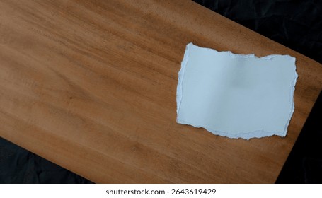 Blank paper scraps on wooden board, quote and notes template
