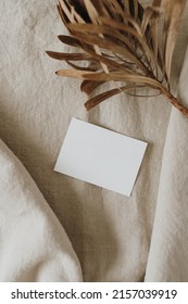 Blank Paper Sheet Card With Mockup Copy Space, Dried Protea Flower On Neutral Beige Linen Blanket. Minimal Aesthetic Business Brand Template. Flat Lay, Top View