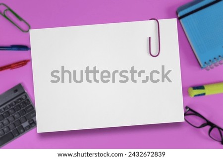 Blank paper sheet. Empty Notebook page on blurred background of stationery on table. Back to School or business Concept. Copyspace, message, design. Teacher's Day or Business style.