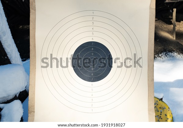 Blank paper target with shooting range numbers. A
round, clean target with a marked bull's-eye for shooting practice
on the range