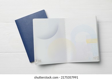Blank passports on white wooden table, flat lay - Shutterstock ID 2175357991
