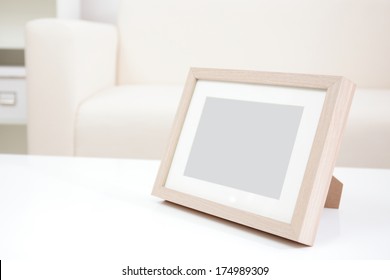 Blank Photo Frame With Copy Space On White Table At Home