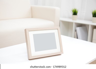 Blank Photo Frame With Copy Space On White Table At Home