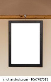 Blank Photo Frame Hanging On A Dado Rail In A Living Room