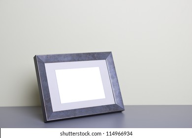 Blank Picture Frame At The Desk