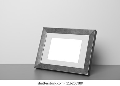 Blank Picture Frame At The Desk