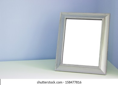 Blank Picture Frame At The Desk 