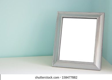 Blank Picture Frame At The Desk 