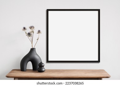 Blank picture frame mockup on a wall. Square orientation. Artwork template in interior design