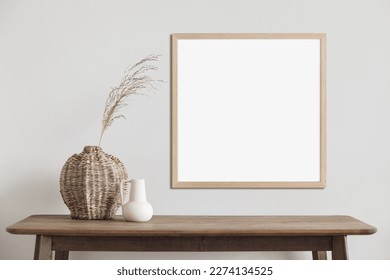 Blank picture frame mockup on a wall. Square orientation. Artwork template in interior design