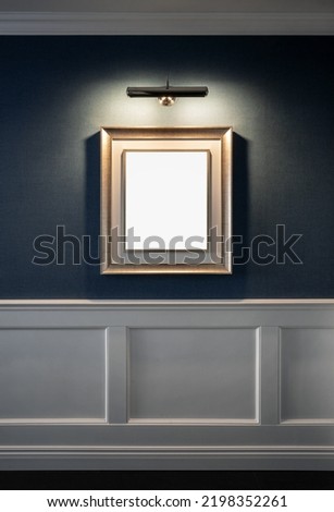 Blank picture frame on the wall with copy space