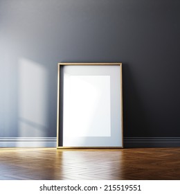 Blank picture frame and sunlight on a wall