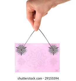 Blank pink patterned paper leaf in hand