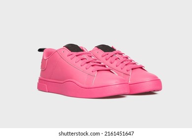 Blank Pink women's basketball tennis sneakers, sports shoes, boots for female isolated on white background. Footwear, pair of casual leather training shoes. Template, mock up