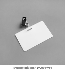Blank plastic badge mockup on gray paper background. Empty ID mock up. Copy space for text. Blank template for for ID. - Shutterstock ID 1920344984