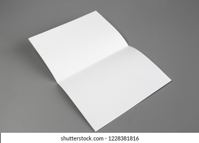 Blank portrait mock-up paper. brochure magazine isolated on gray, changeable background / white paper isolated on gray - Shutterstock ID 1228381816