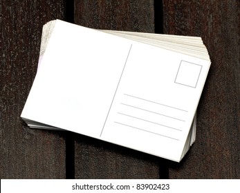 Blank Postcards On Wooden Table