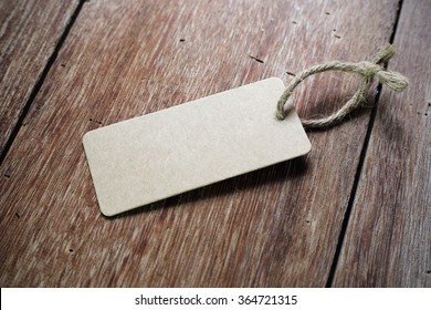 The Blank Price Tag Label On Wooden Background 